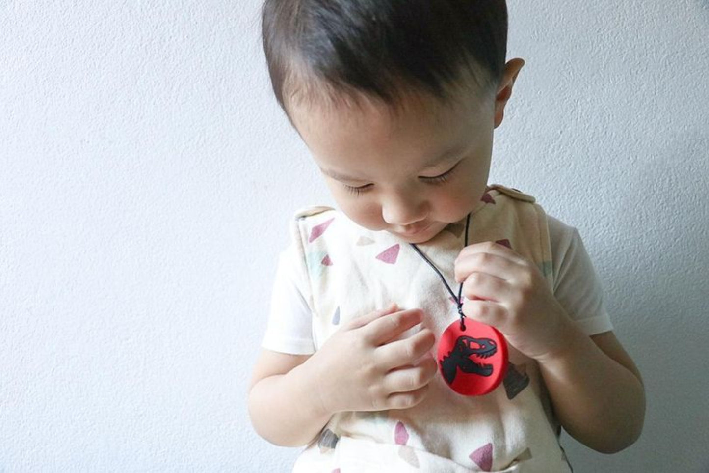 Dino Kau-Kette mit Kind