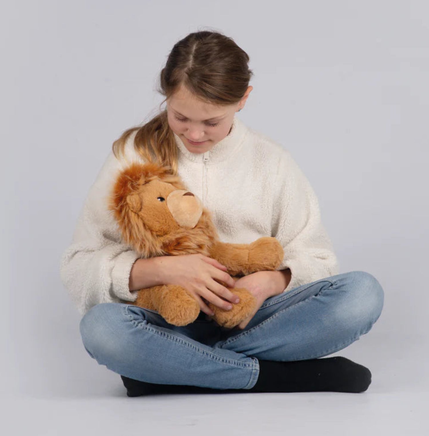Kind mit Löwe auf dem Schoß