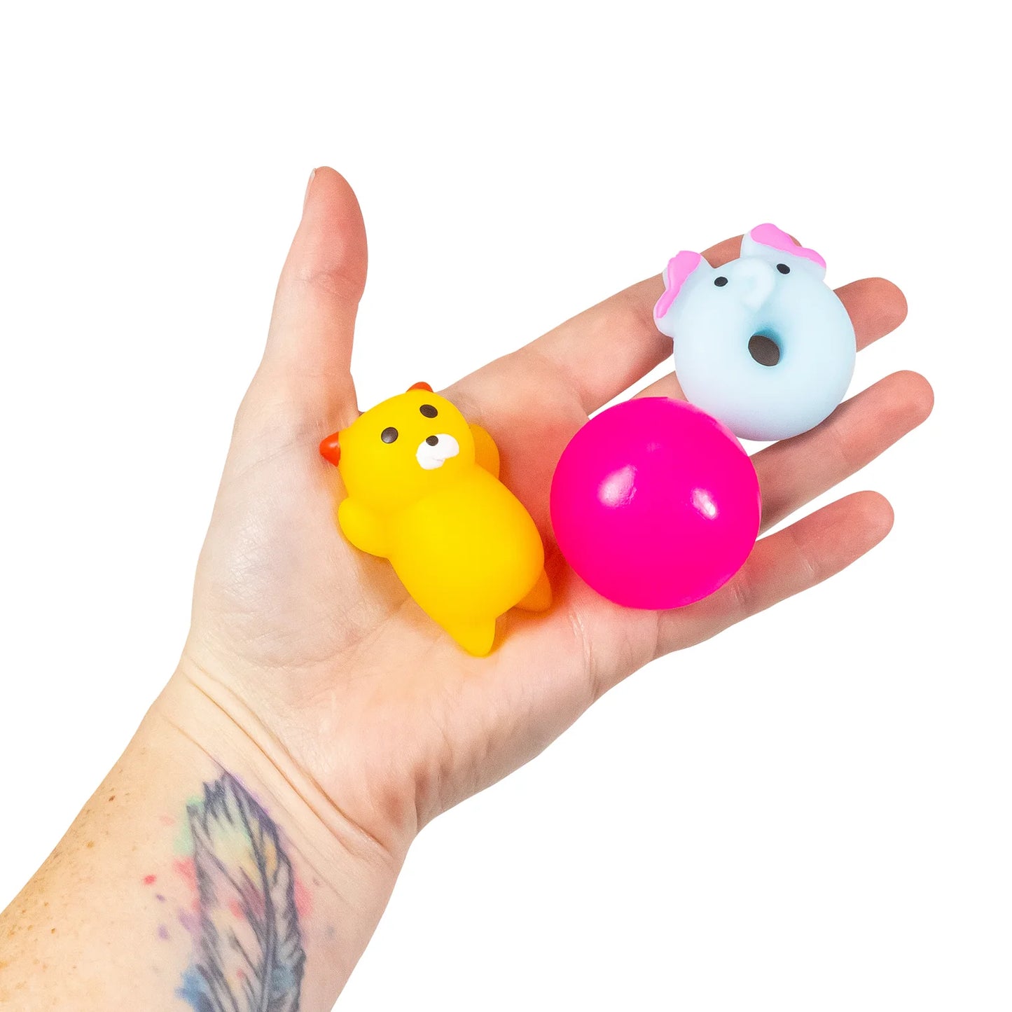 drei Fidget Toys in der Hand